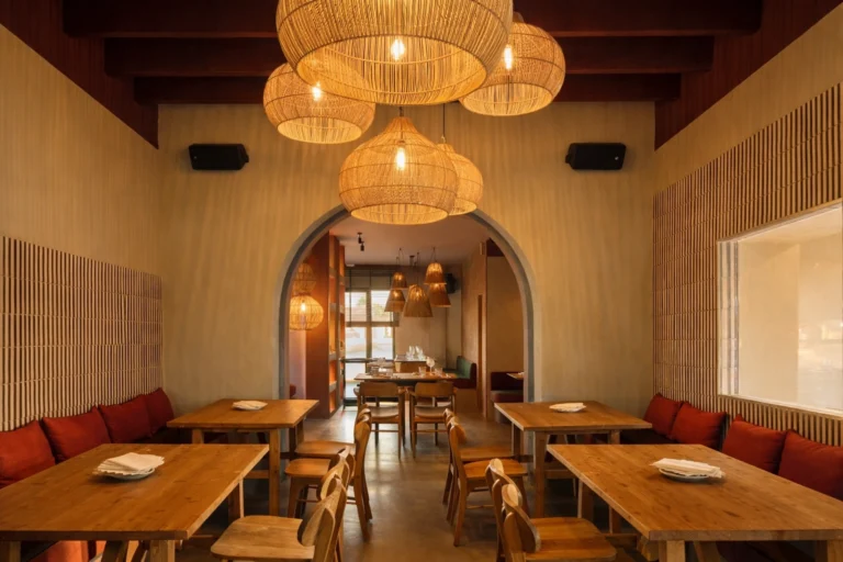 Restaurant dining room with rattan pendant lamps