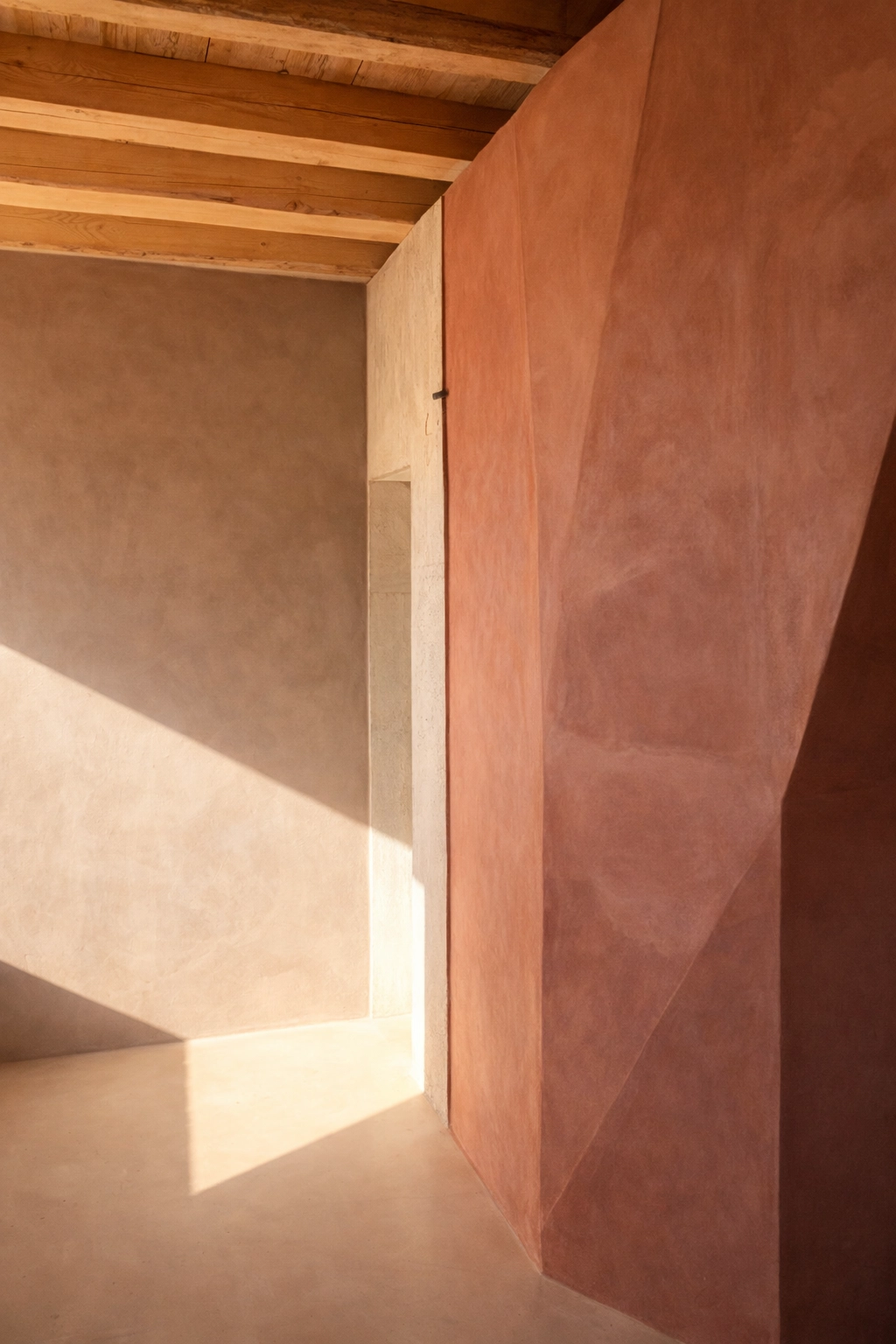 Interior with a terracotta wall and natural light